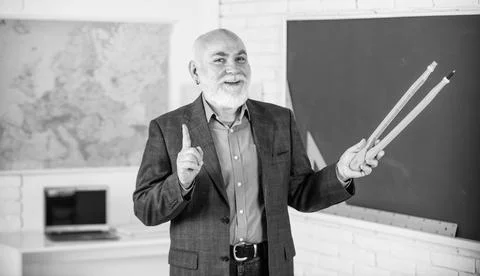 Review Errors. bearded tutor man draw with compass on blackboard. back to school Stock Photos