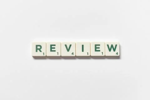 Review formed of scrabble elements on white background. Foto stock
