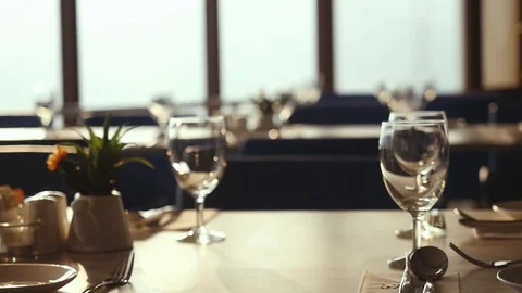 Review hall with decorated table, cutlery and chairs in restaurant decorated for Stock Footage 88201208