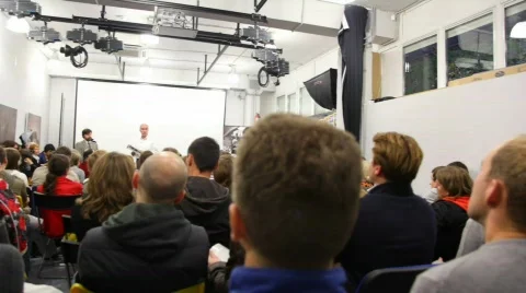 Review presentation of magazine National Geographic's in hall with people Stock Footage