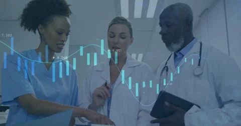 Reviewing charts, three docs scanning tablet and documents with data overlay, Stock Photos