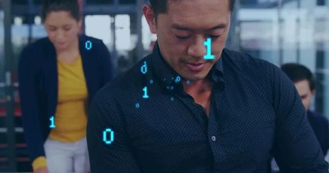 Reviewing code, Asian man wearing dark blue shirt collaborating at workstation, 写真素材