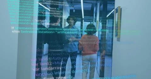 Reviewing code, three developers gathering in office hallway with digital Photos