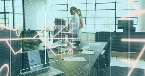 Reviewing code, two colleagues in business casual at open office, with laptop, Stock Photos