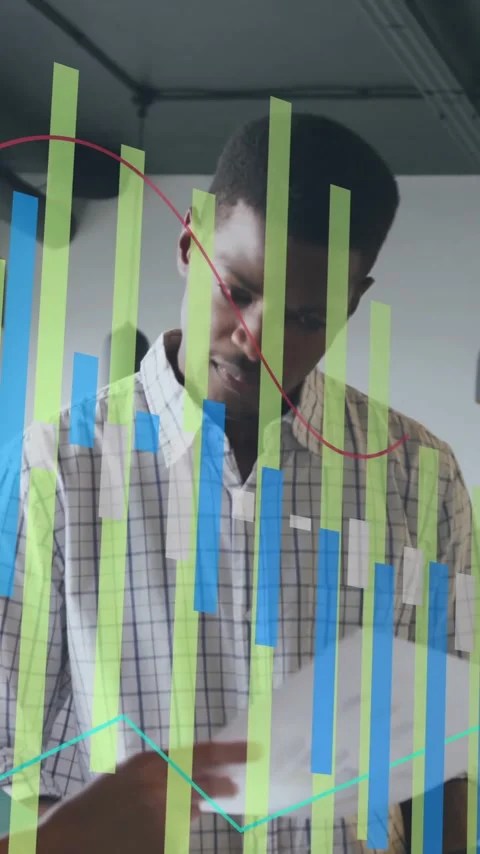 Reviewing documents, business colleagues analyzing data visualization overlay in Stock Footage 344370480