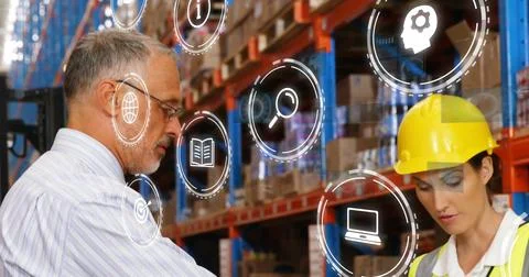 Reviewing inventory supervisor, engineer using tablet at warehouse center with Foto stock