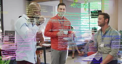 Reviewing male developer in red pullover outlining plan in office, with lapto 스톡 사진