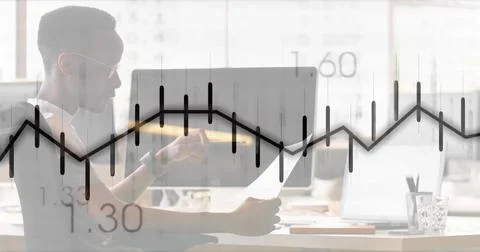 Reviewing man pointing at printed document on office desk with chart overlay, Stock Photos