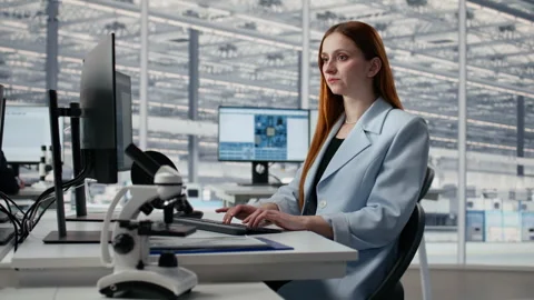 Reviewing microchip production operations, PC software and man with woman Stock Footage 335881021