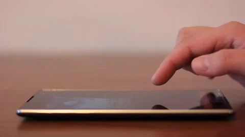 Reviewing pictures on tablet computer Stock Footage 64847365