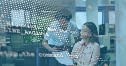 Reviewing team checking docs at office table, woman wearing pink blouse holding Stock Photos
