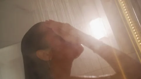 Revitalizing bath with tranquil ambiance and luminous droplets. Energizing Video stock 331460915