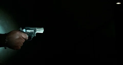 Revolver Fires, Medium Shot Stock Footage 77796637