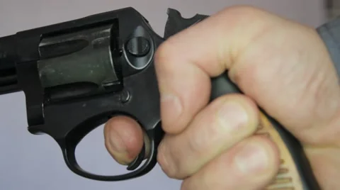 Revolver in hand Stock Footage 59601166