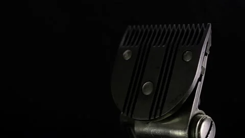 Revolves metal vintage barber tool old manual clipper. on black background. Edge Video stock 142135785