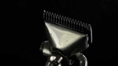 Revolves metal vintage barber tool old manual clipper. on black background. Edge Stock Footage 142135907