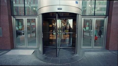 Revolving door with traffic reflected Stock Footage 50519084