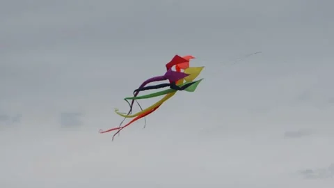 Revolving multi-colored kite Stock Footage 163182939