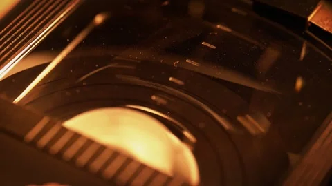 Rewinding the Video Tape Inside of the Dusty Plastic Cassette Stock Footage 272876613
