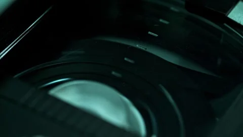 Rewinding the Video Tape Inside of the Dusty Plastic Cassette Shell Stock Footage 278830632