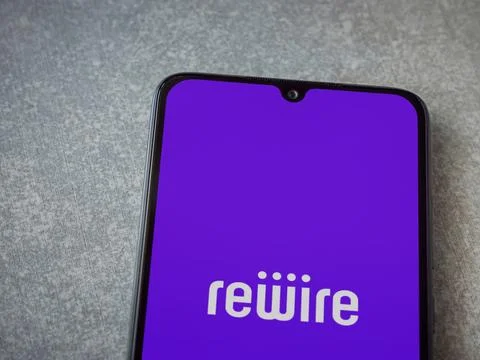 Rewire app launch screen on smartphone on ceramic stone background Stock Photos