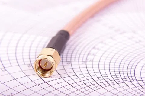 RF cable with SMA connector on the Smith chart Stock Photos