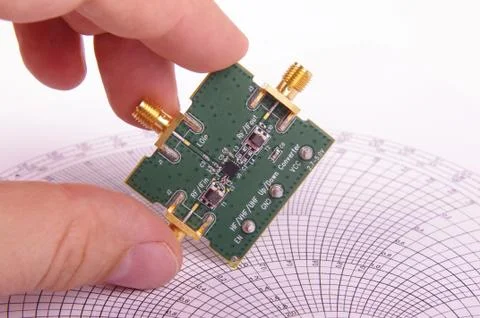RF engineer inspect microwave mixer PCB Stock Photos