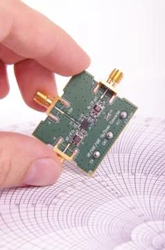 RF engineer inspect microwave mixer PCB Stock Photos