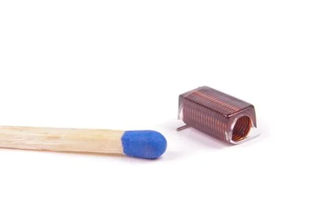 RF inductor for electronics in comparison with match head Stock Photos
