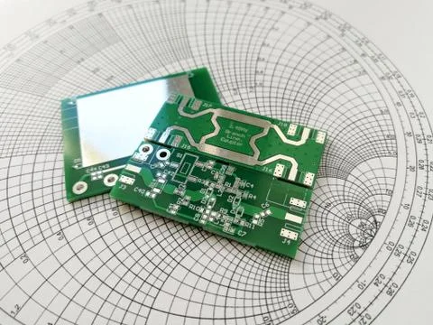 RF PCB in front of Smith chart Stock Photos