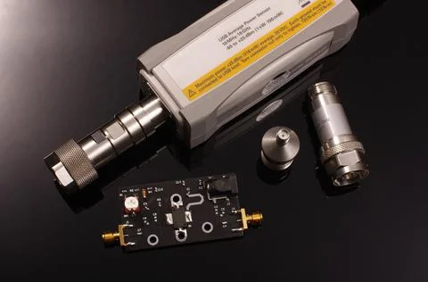 RF power sensor and microwave PCB isolated on black Stock Photos