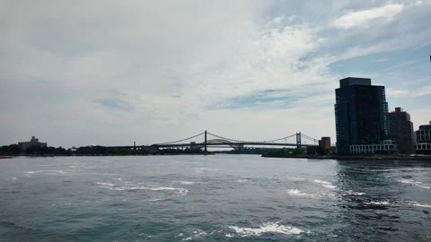 RFK Bridge and Hell Gate Bridge from East River, New York City Stock Footage 340229659