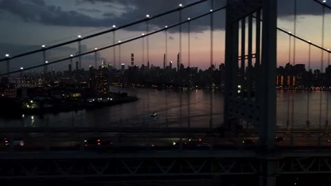 RFK Bridge, Ferry &amp; New York Skyline @ Twilight by Tracking 4K Drone Aerial Shot Stock Footage 165360785