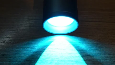 RGB flashlight shines on the table Stock Footage 327073817