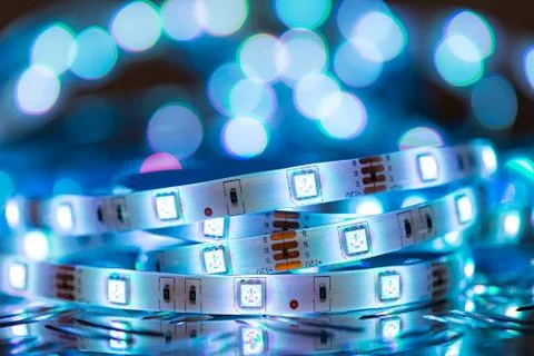 RGB LED light strip in front of colorful bokeh metal diamond plate background Stock Photos