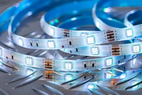 RGB LED light strip in front of colorful bokeh metal diamond plate background Stock Photos
