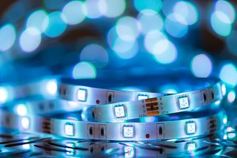 RGB LED light strip in front of colorful bokeh metal diamond plate background Stock Photos