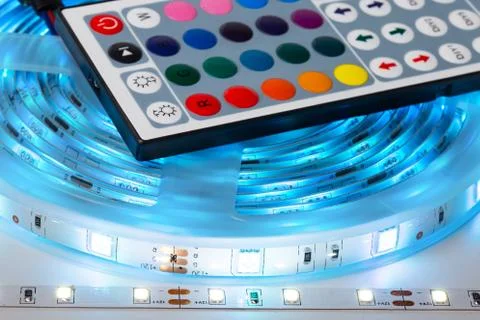 RGB LED light strip with remote control in front of white background Stock Photos