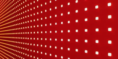 RGB LED screen panel texture. Close-up of a pixel LED screen with bokeh for w Stock Photos