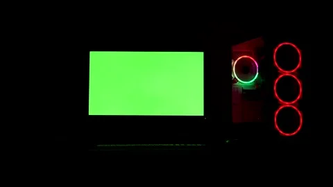 RGB lighting computer pc green screen display in very dark environment Stock Footage 253487548