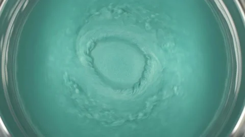 Rheoscopic fluid. Beautiful movement of particles in a liquid. Fantastic Stock Footage 128584684