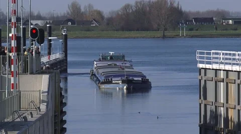 Rhine barge approaches lock, gate opens - medium shot Stock Footage 48128084