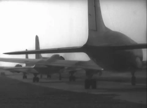 RHINE-MAIN, GERMANY - 1948: Tail lineup - C-54 Tail Dominates the Runway Lineup Stock Footage 344491724