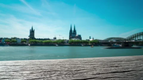 Rhine Skyline of Cologne with selective focus of a wooden railing Stock Footage 231368174