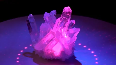 Rhinestone crystal rotates around in colored laser beams. Large crystals of n Stock Footage 152647517