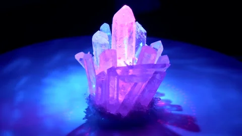 Rhinestone crystal rotates around in colored laser beams. Large crystals of n Stock Footage 152647746
