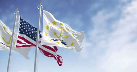 Rhode Island state flag waving with the american flag on a clear day Stock Footage 329106139