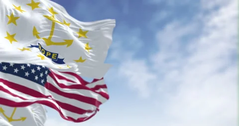 Rhode Island state flags waving with the american flag on a clear day Stock Footage 312680807