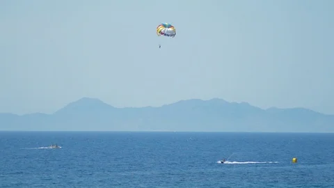 Rhodes, Greece - man parasailing using boat. Stock Footage 111342315