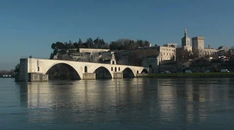 Rhone river with Pont d'Avignon bridge and Palais des Papes palace Stock Footage 62469855